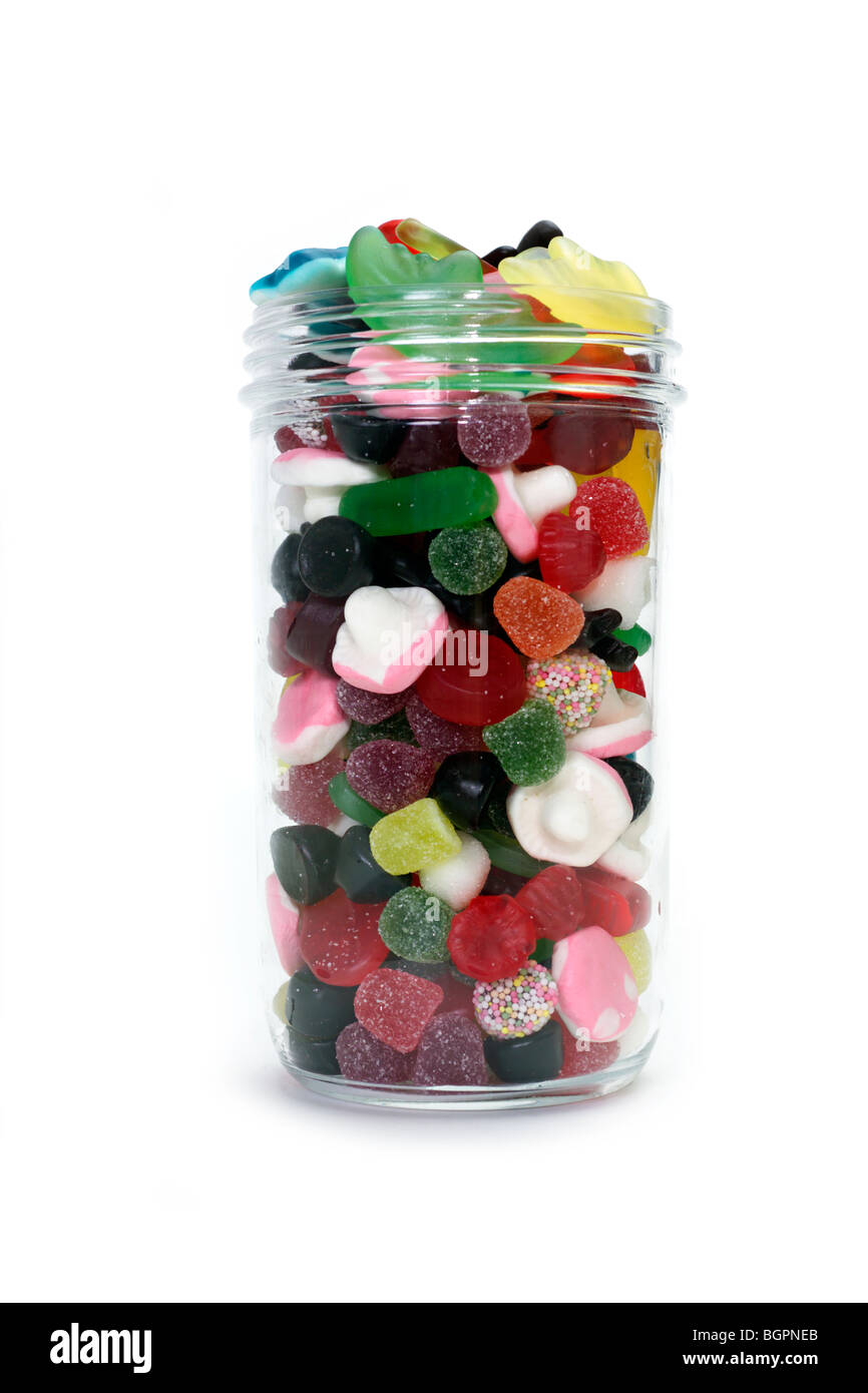 Colorful candy in a jar on white background Stock Photo - Alamy