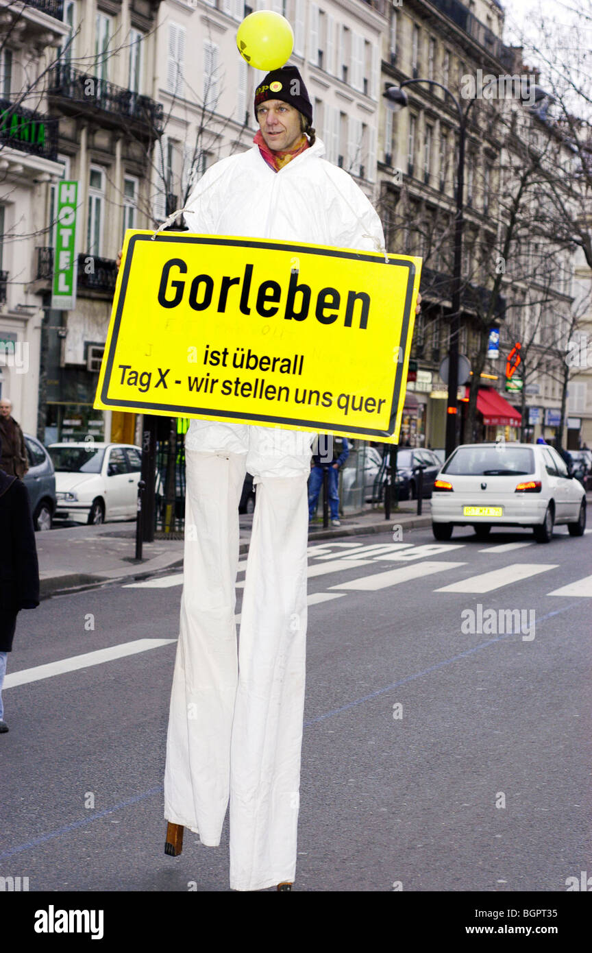 Paris, France, Anti-Nuclear Energy Demonstration, with Man Walking on Stilts, Carrying Protest sign in German, nuclear energy protest Stock Photo