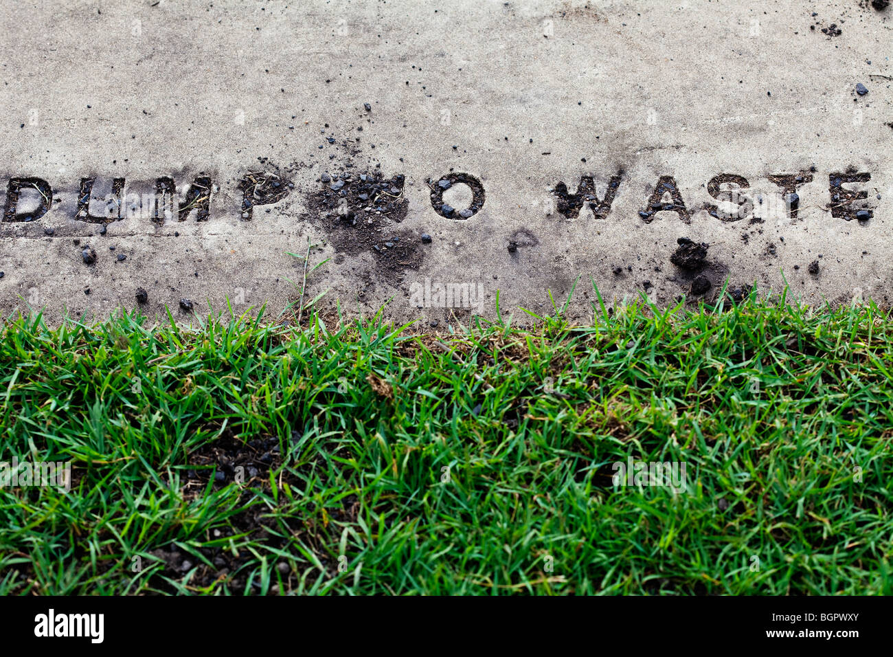 Sign cement green litter footpath grunge industrial hires stock