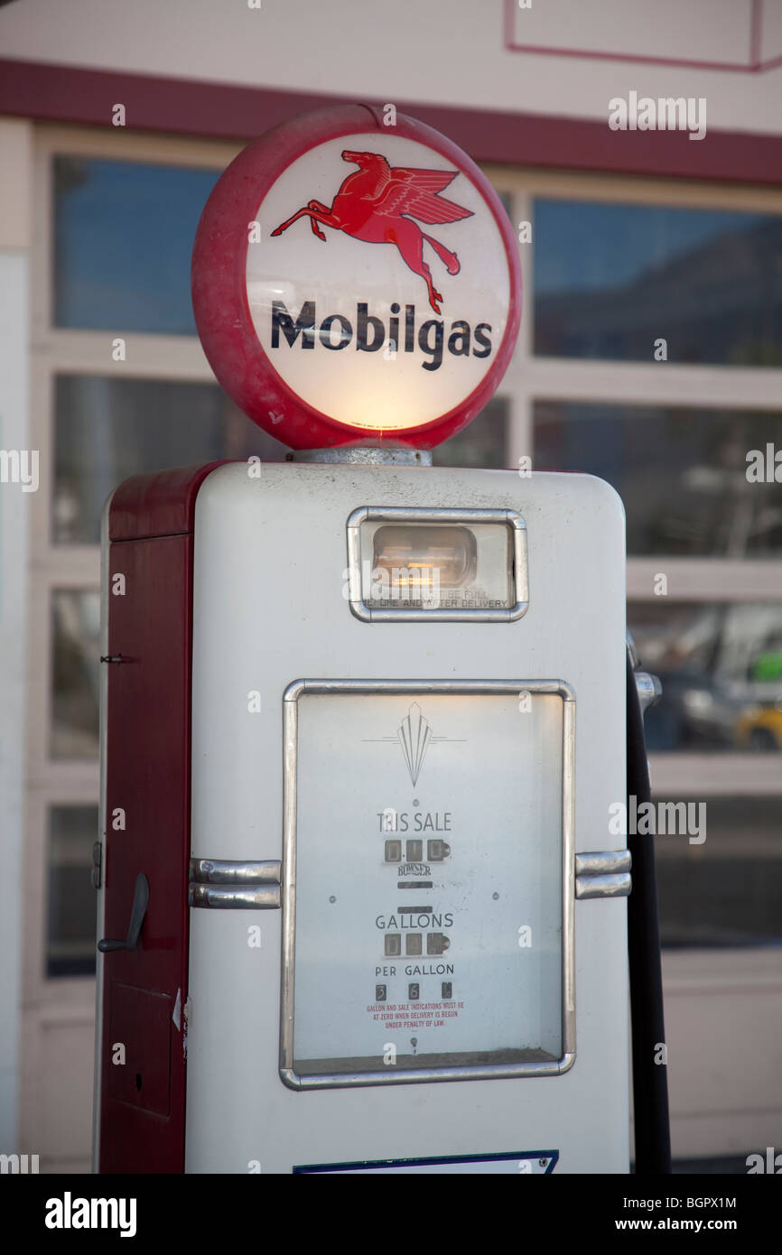 Historic Mobilgas gasoline pump with lighted circular top showing 'Pegasus' the Mobil oil emblem. Stock Photo