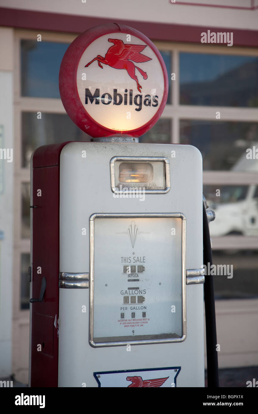 Historic Mobilgas gasoline pump with lighted circular top showing 'Pegasus' the Mobil oil emblem. Stock Photo