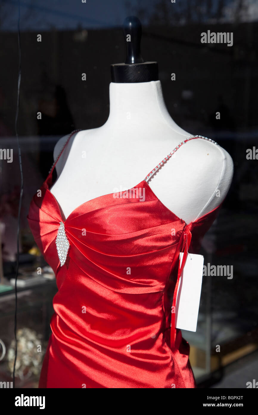 A fancy cocktail dress is displayed in a store window in the small Santa Clara Valley town of Fillmore located in Ventura County Stock Photo
