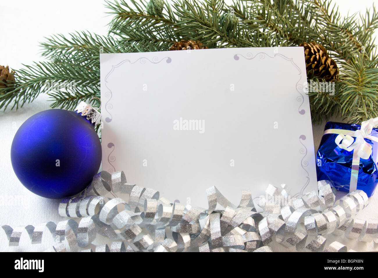 blank Christmas card with blue ornaments, fir branch and copyspace Stock Photo