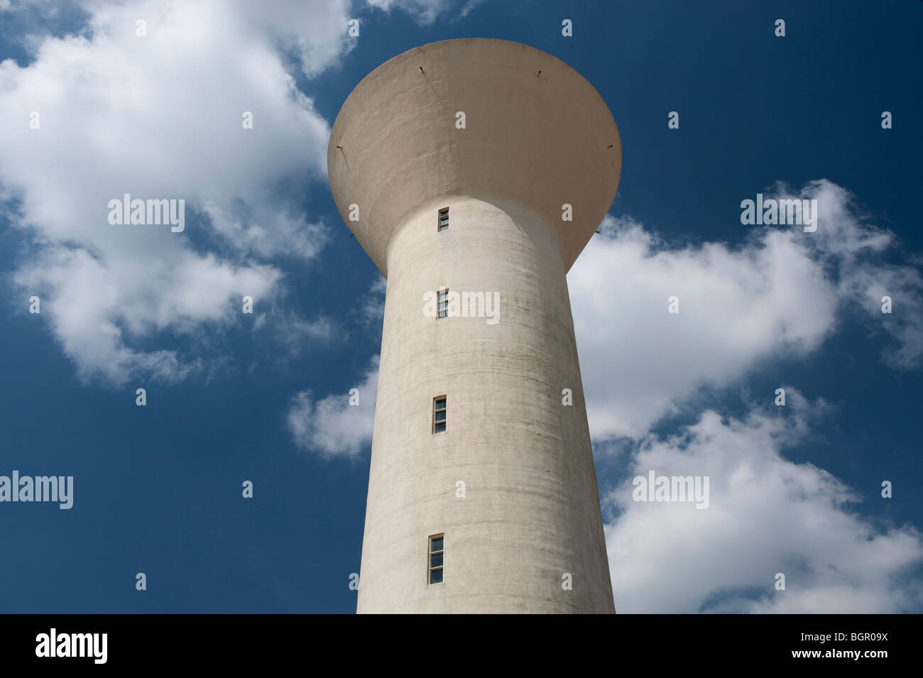 A water tower against a blue sky and clouds Stock Photo - Alamy