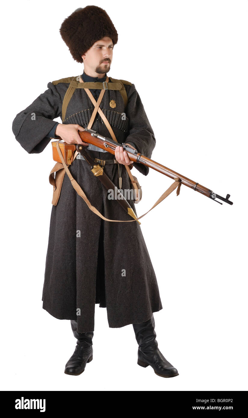 Man in vintage costume of Russian Cossack with a rifle. Stock Photo