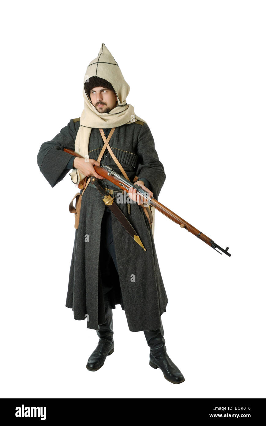 Man in vintage costume of Russian Cossack with rifle. Stock Photo