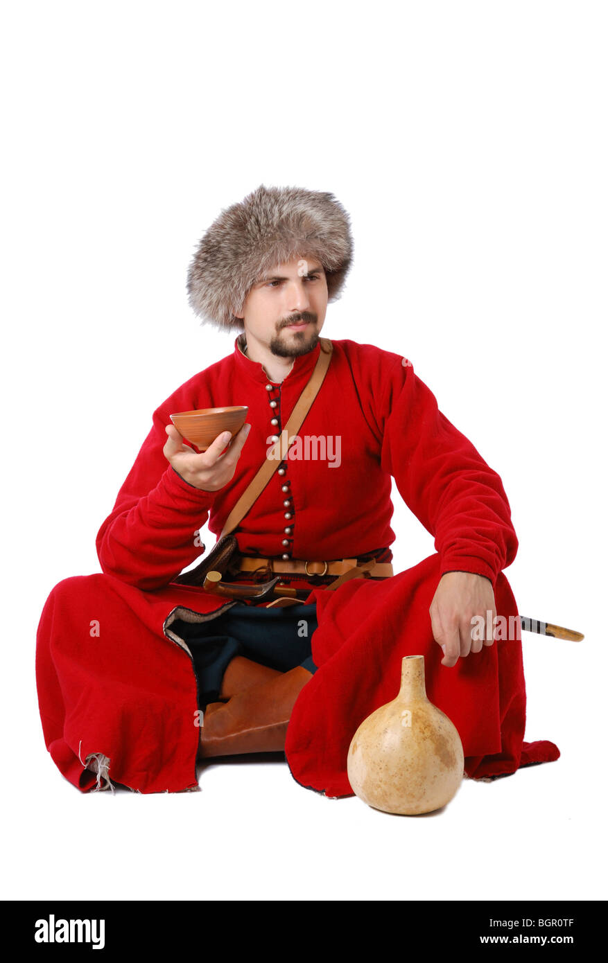 Tatar warrior sitting with a cup and a calabash Stock Photo - Alamy