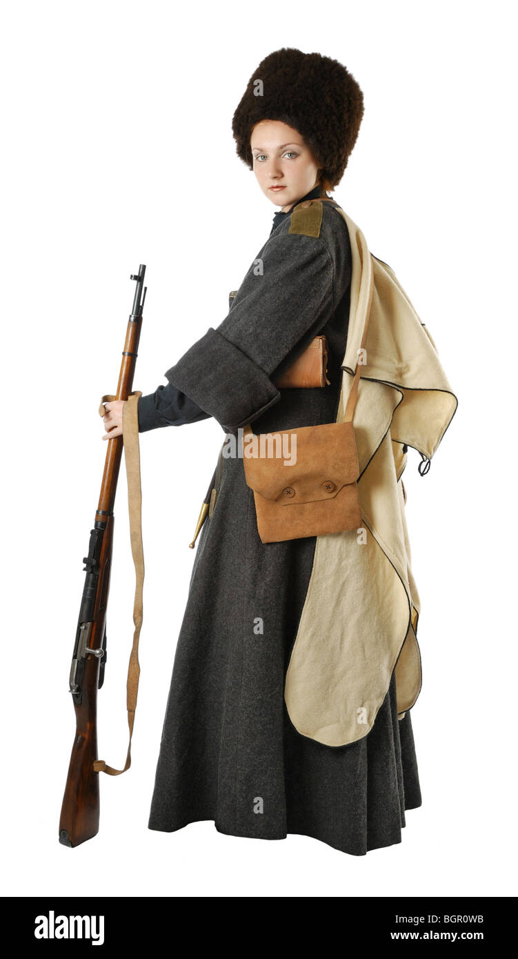 Woman in vintage costume of Russian Cossack with a rifle. Stock Photo