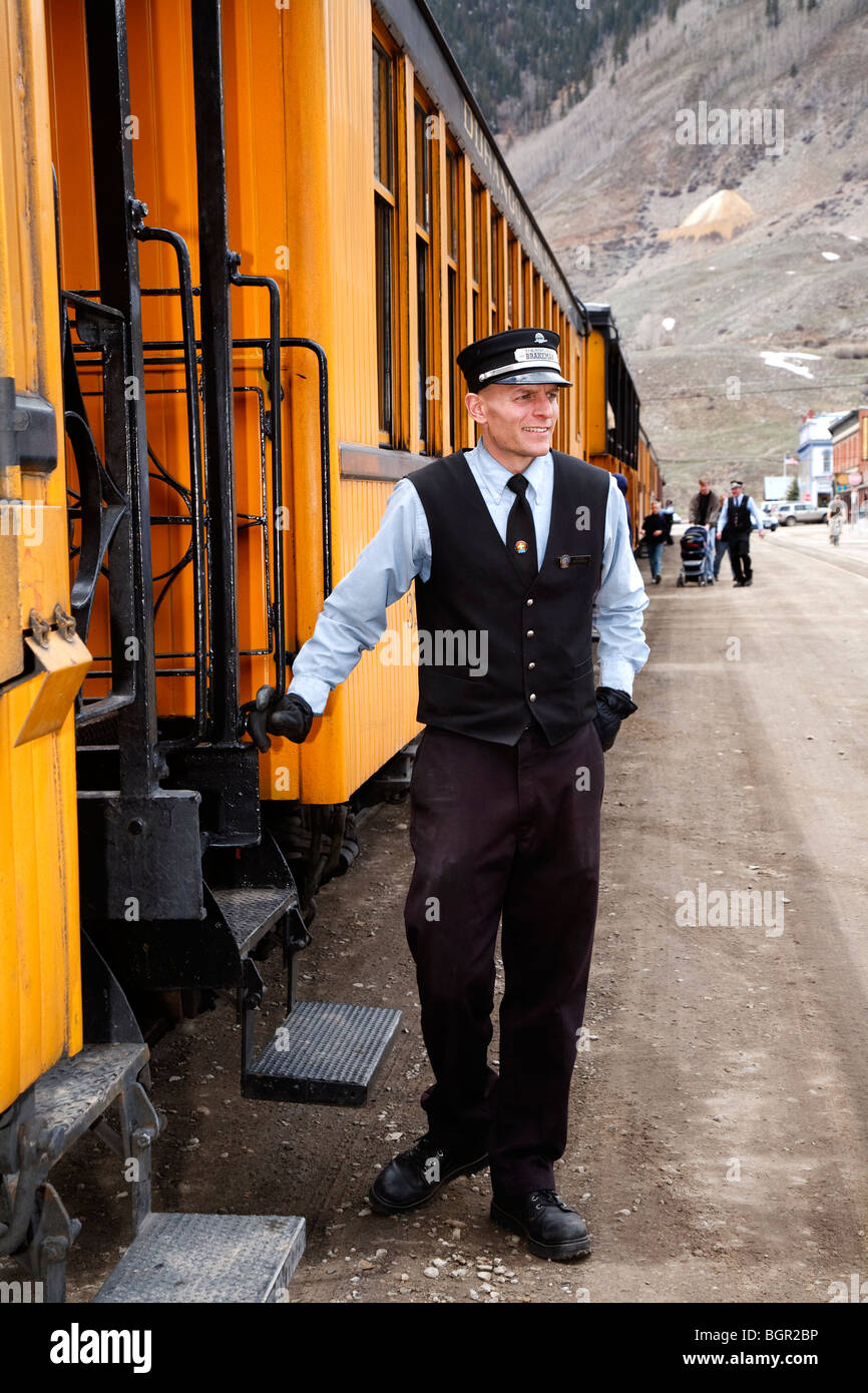 Brake man and guard standing beside the old steam Durango-Silverton train at Silverton, Colorado, USA Stock Photo