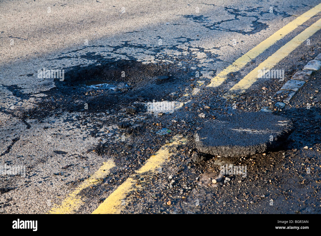 Pot hole in Crowthorne Road, Sandhurst following snow and freezing
