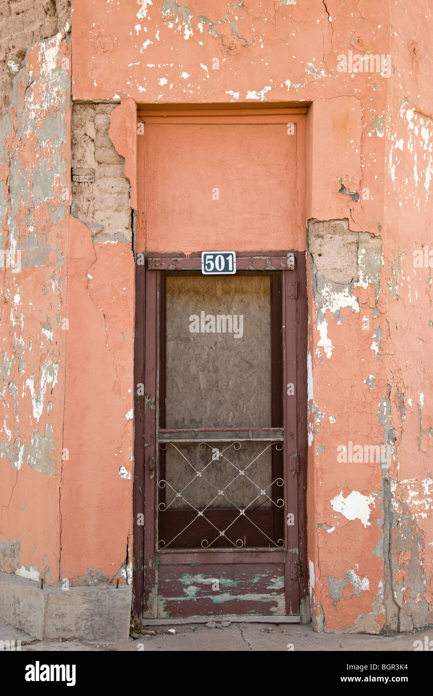 An old adobe building falls into ruin in downtown Carrizozo, New Mexico. Stock Photo