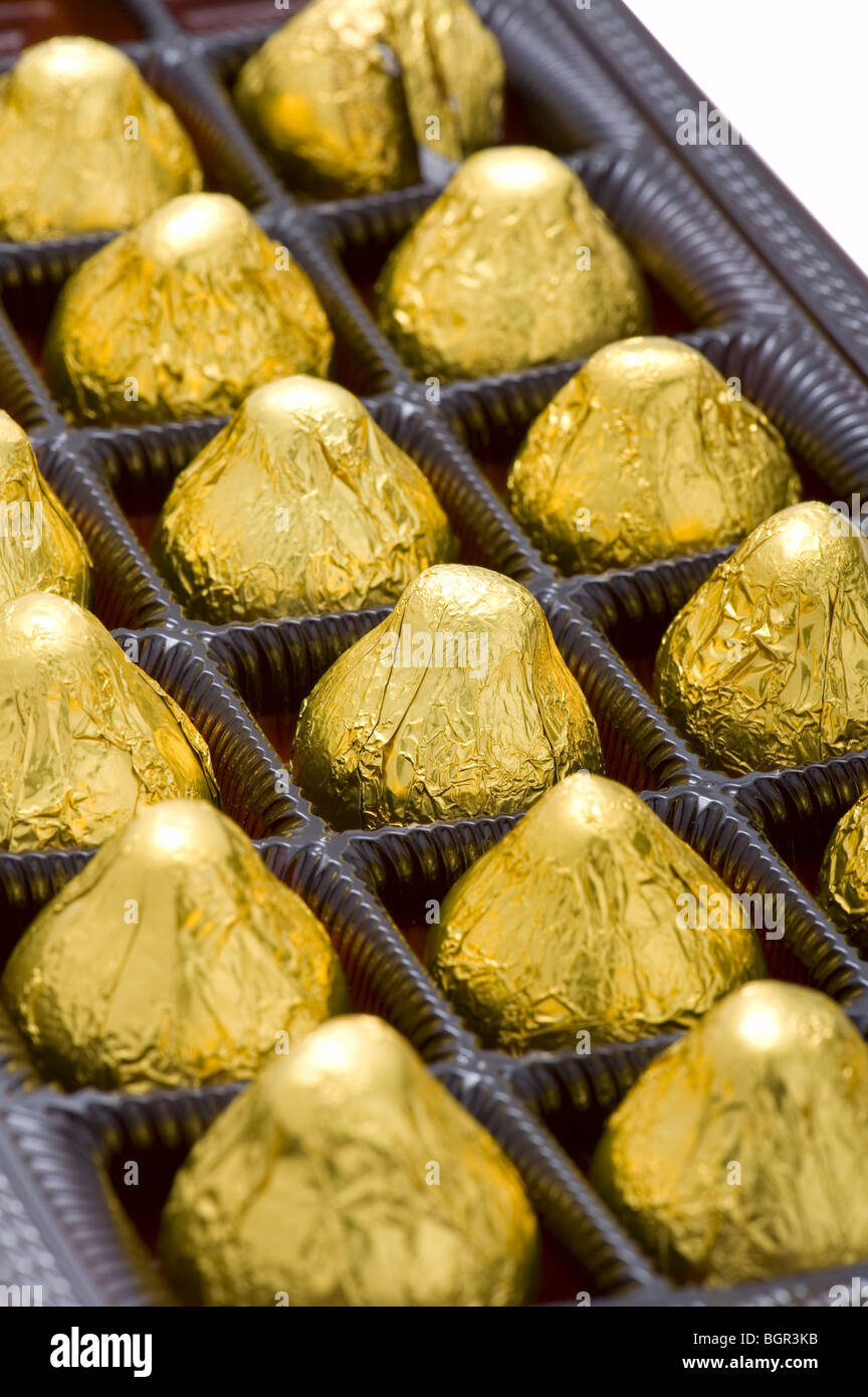 chocolate candy in box on white close up Stock Photo Alamy