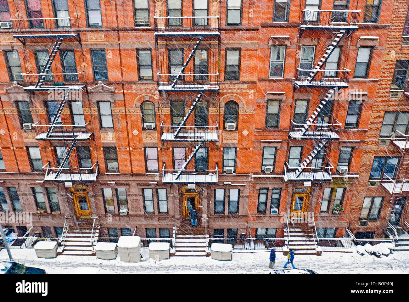 Tenement Apartment Buildings In New York City During Winter Snowstorm 