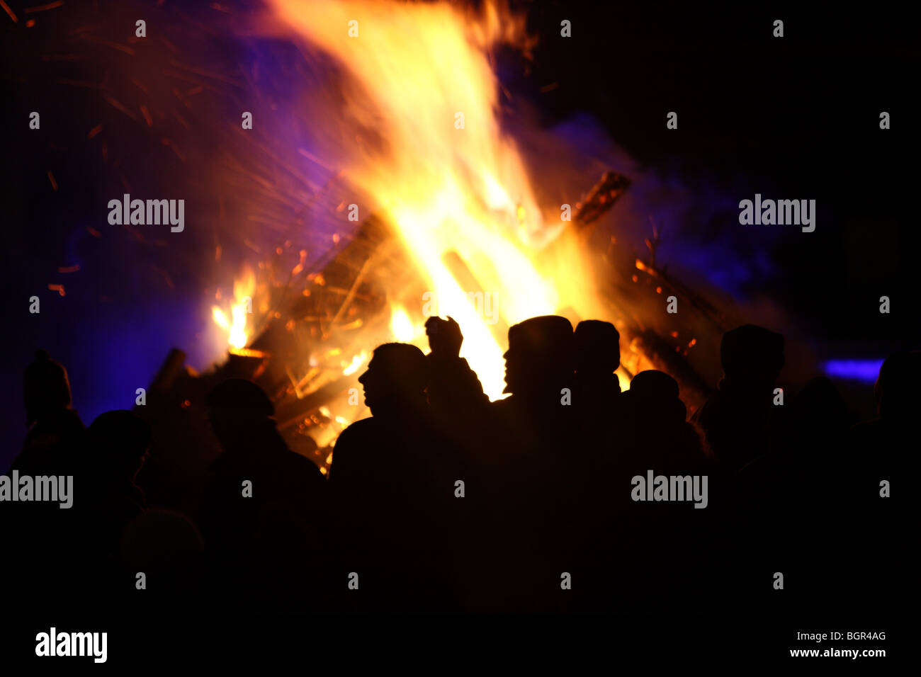 people in front of a big camp fire, Essen, NRW, Germany Stock Photo