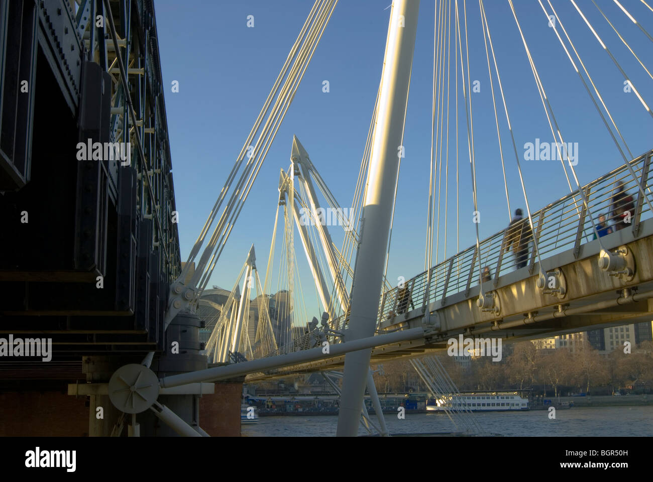 Hungerford Bridge on the River Thames at Charing Cross and the east side Golden Jubilee Bridge Stock Photo