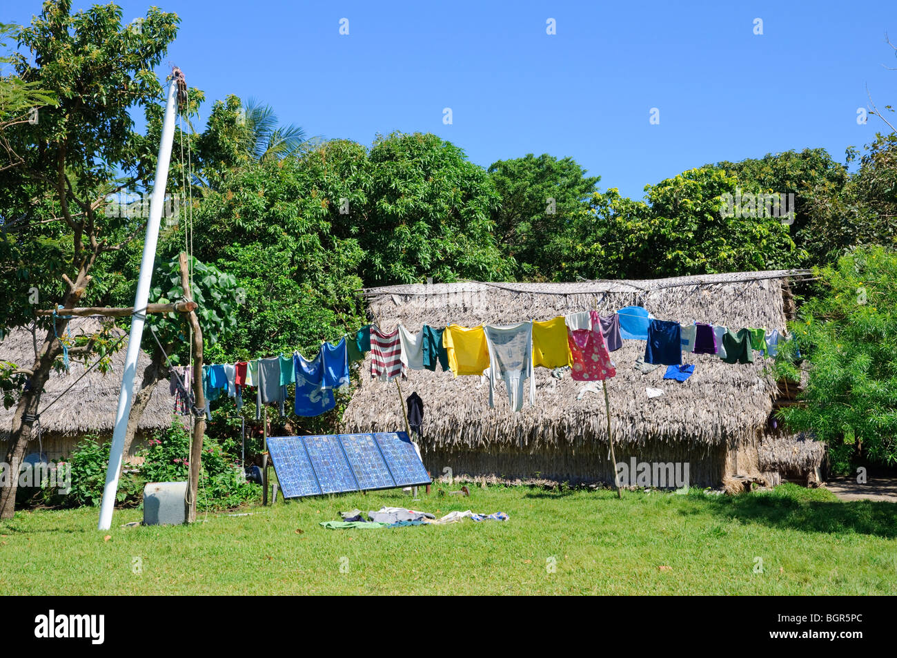 Solar panels power traditional homes in a remote, isolated village Stock Photo