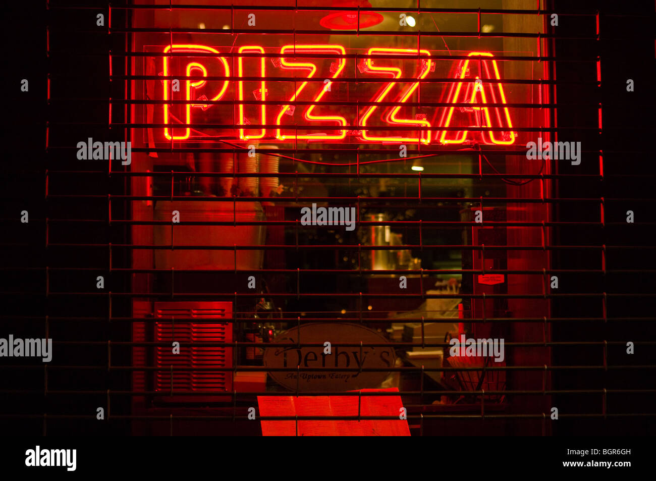 Neon sign in the window of a closed pizza parlor in New York City. Stock Photo