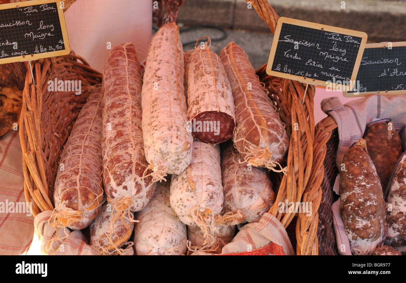 Cured meat and pork sausage for sale at a French street market Stock Photo