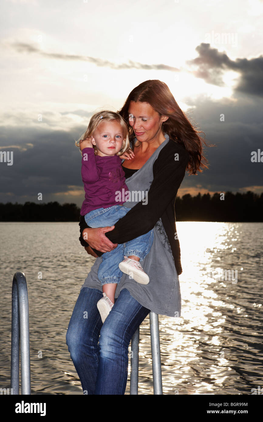 Mother and daughter by the sea. Stock Photo