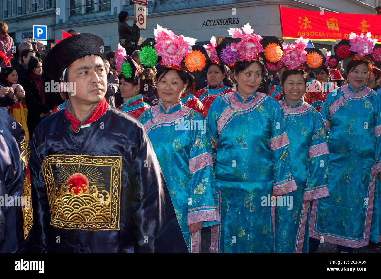 Paris, France, French Chinese Large Crowd People, Marching in Costume, Parade in 'Chinese new year' Carnival in Street, WOMEN IN  crowd faces, Chinese migrants and europe Stock Photo
