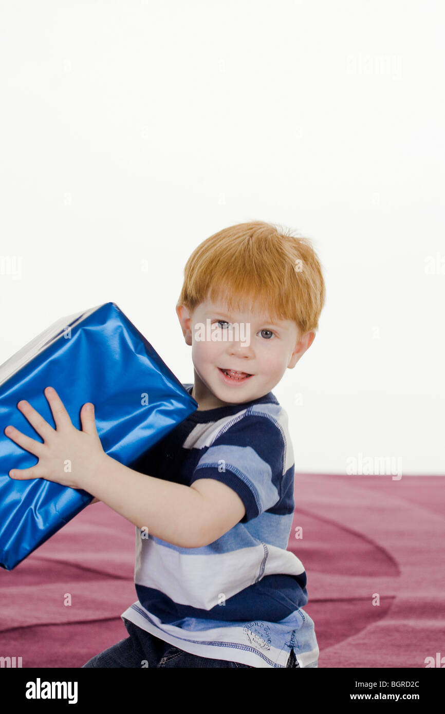 Little boy with a gift. Stock Photo