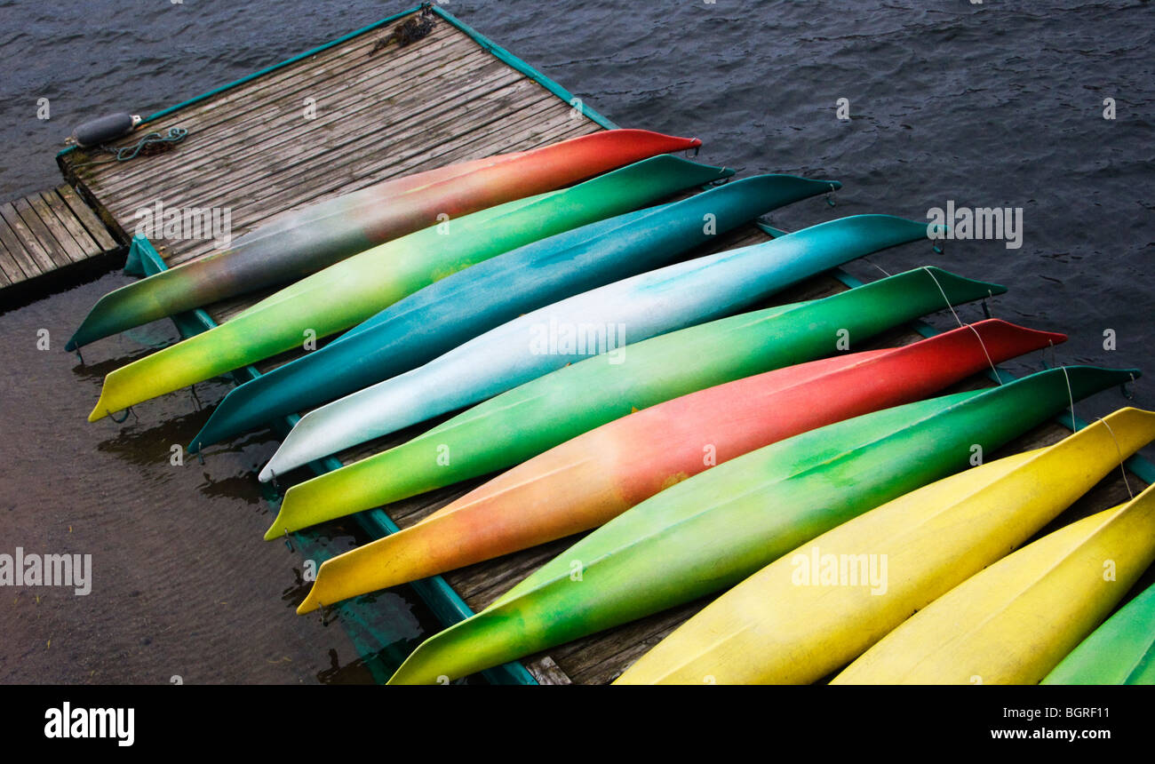 Kayaks in different colors on a jetty, Sweden. Stock Photo