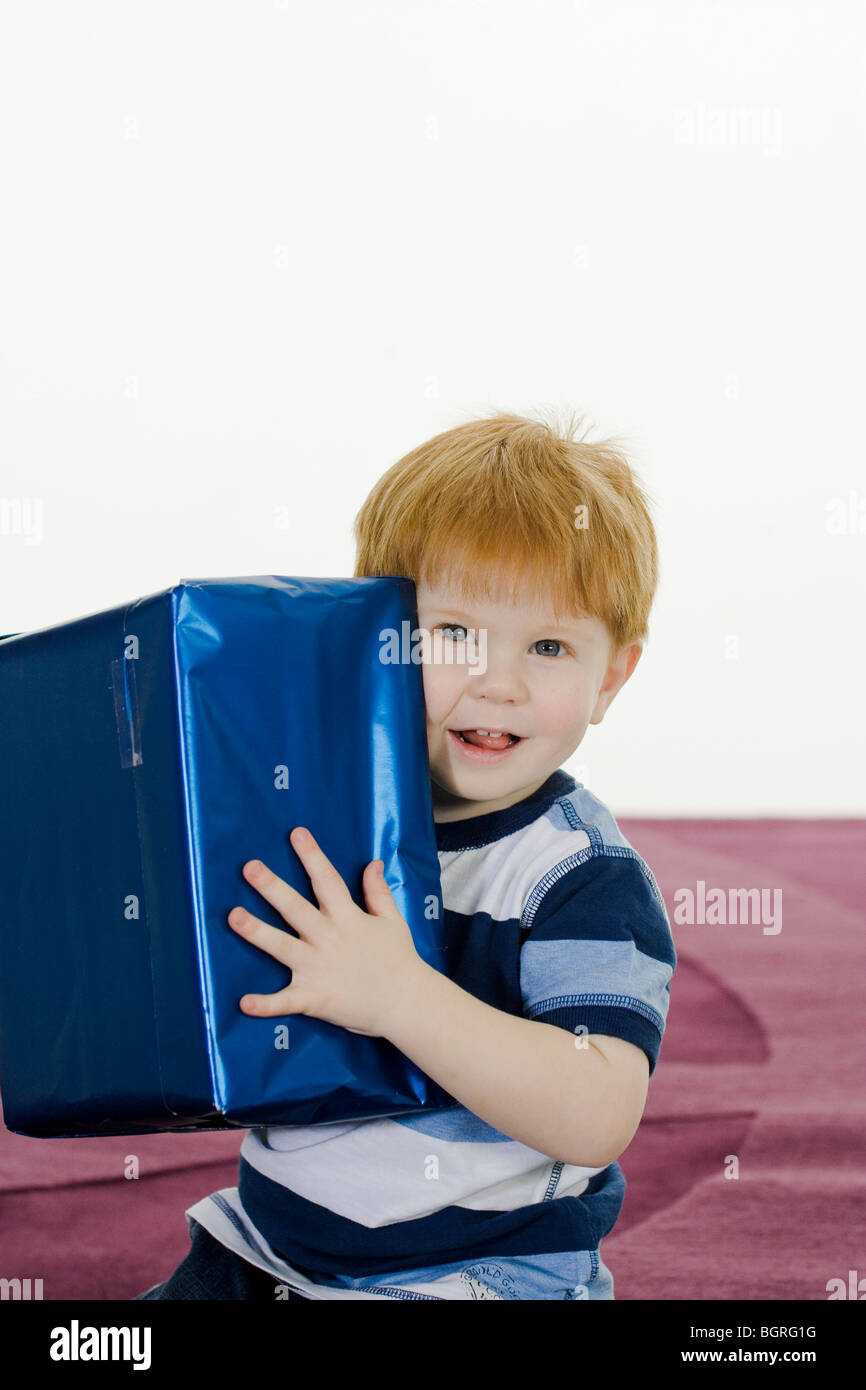 Little boy with a gift. Stock Photo