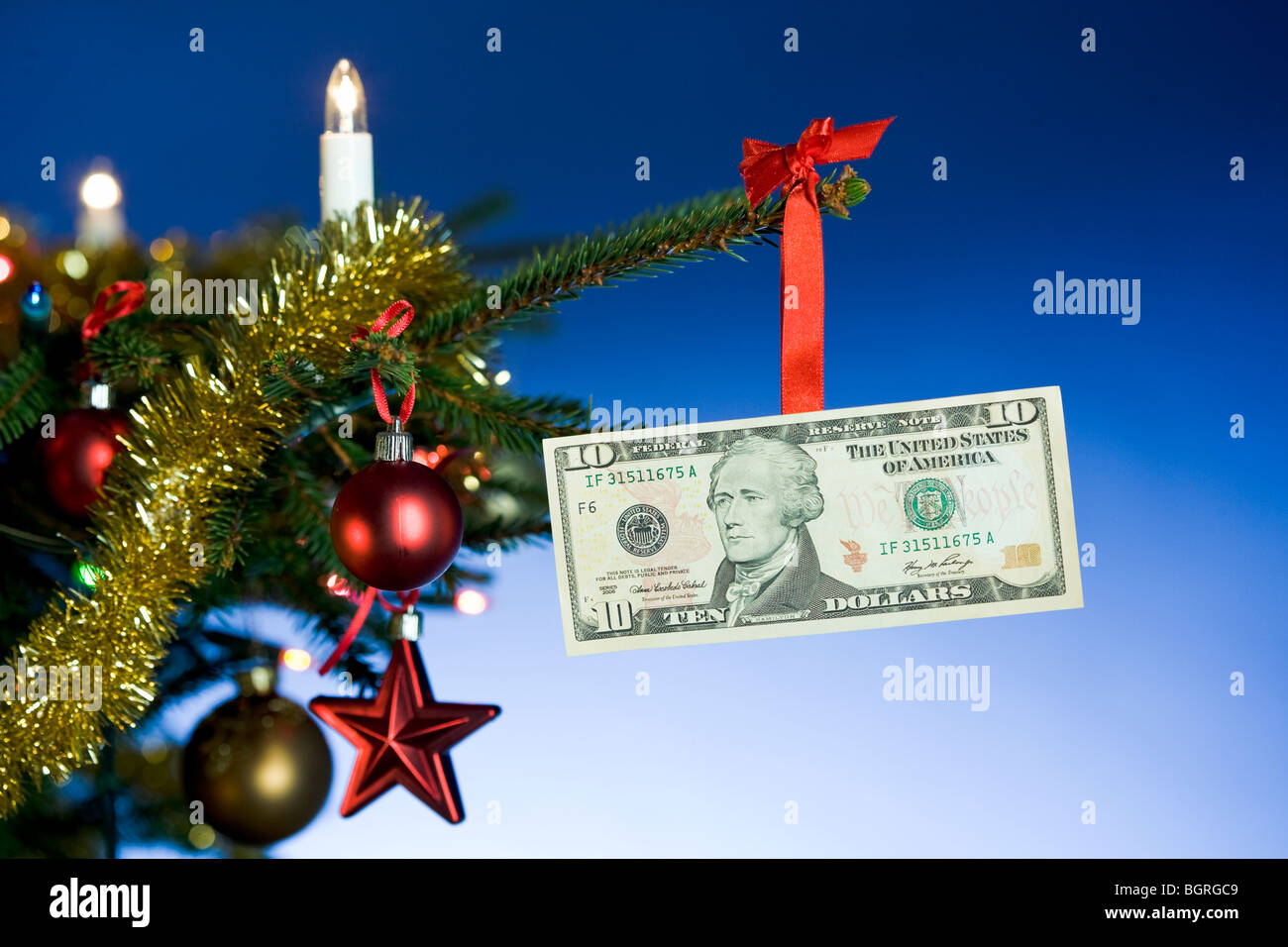 A dollar bill hanging in a Christmas tree Stock Photo Alamy