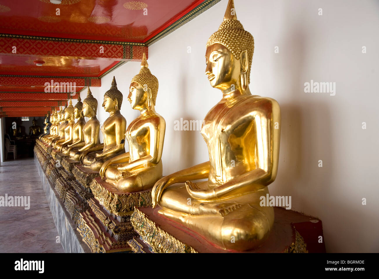 Row of Gold Statues at Wat Pho, bangkok Stock Photo