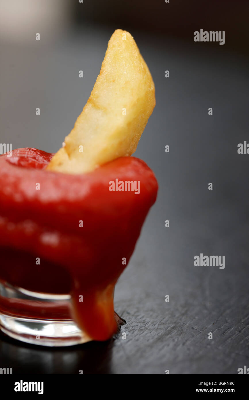 Chip in Tomato Ketchup Stock Photo Alamy