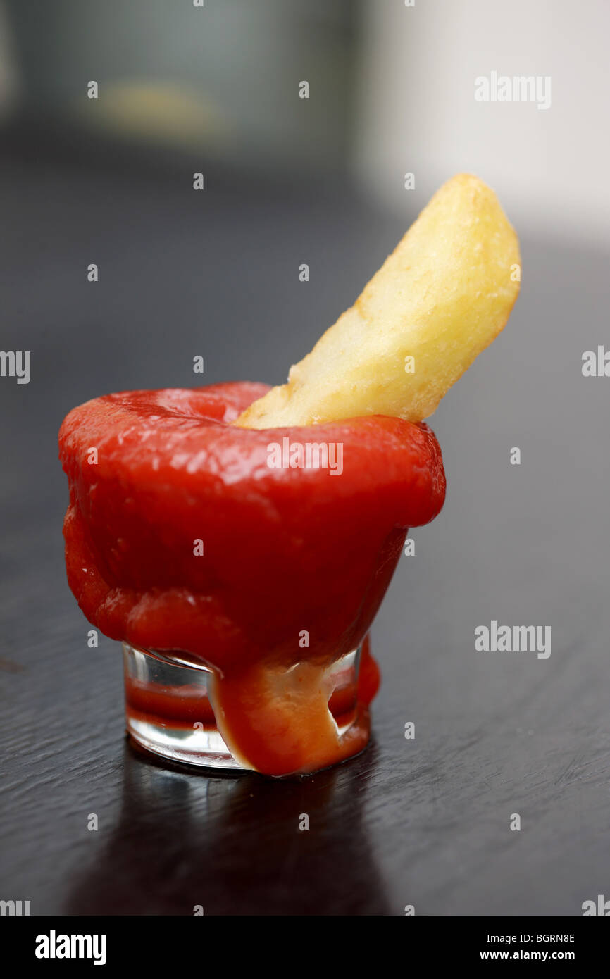 Chip in Tomato Ketchup Stock Photo Alamy