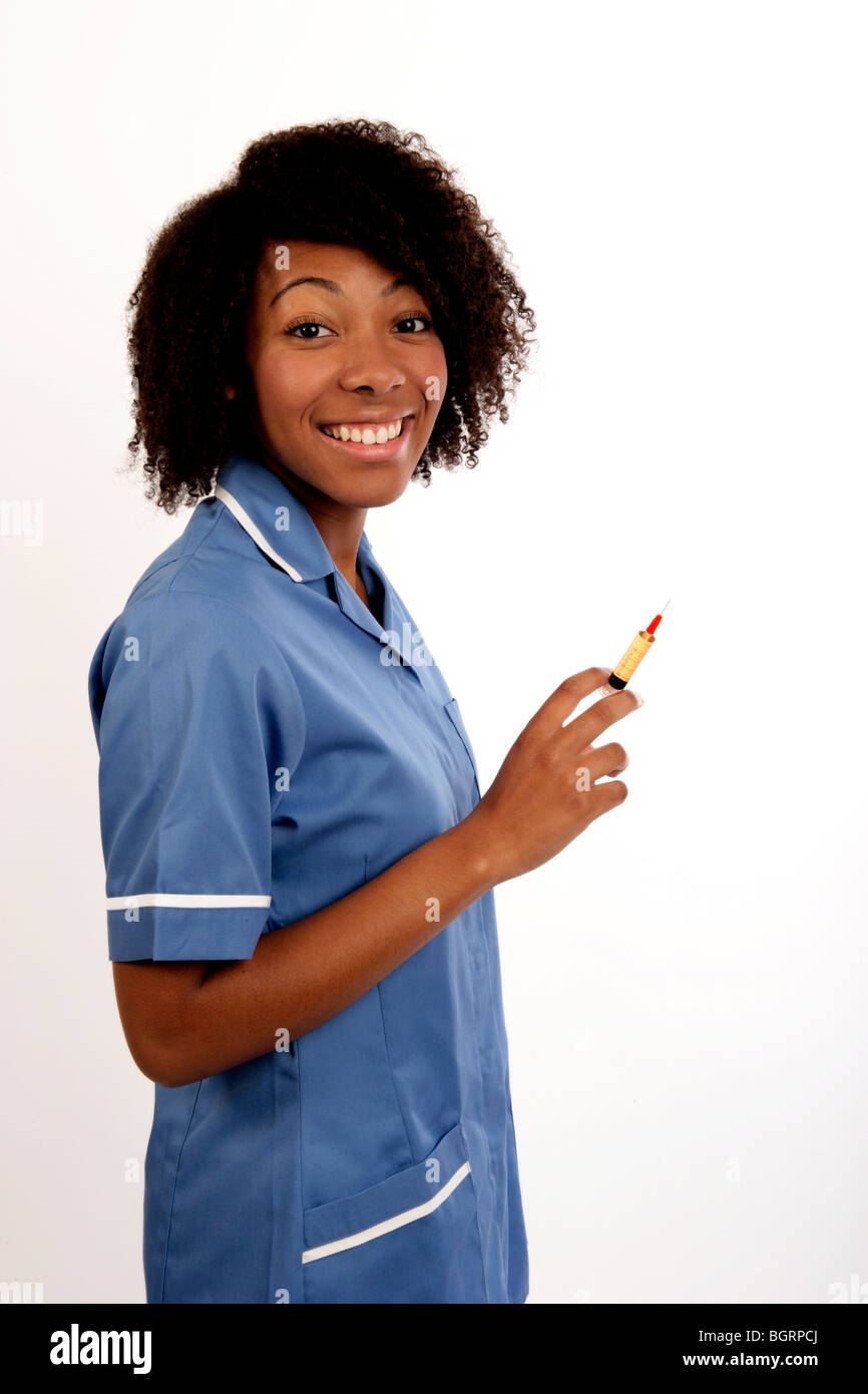 young nurse holding a syringe ready for an injection Stock Photo
