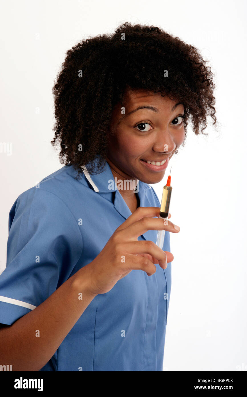 young nurse holding a syringe ready for an injection Stock Photo
