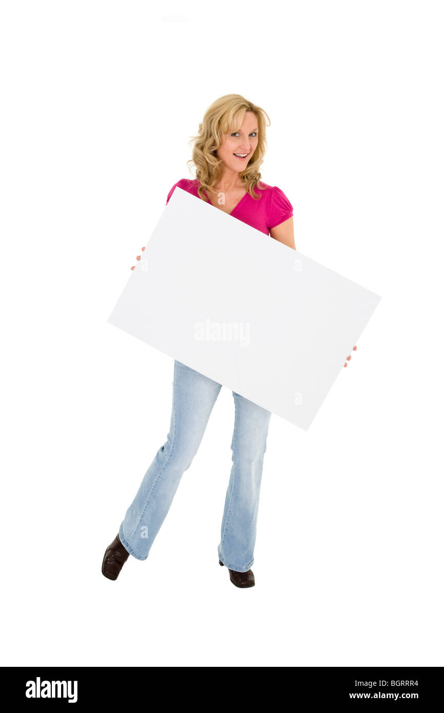Beautiful Caucasian woman holding a blank sign so you can add your own advertising slogan. She is on a white background. Stock Photo