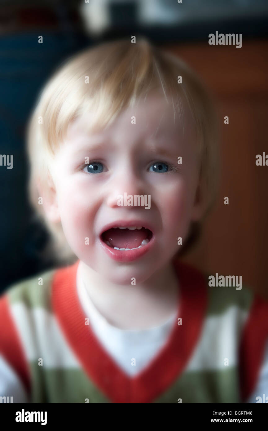 Young blue eyed blonde haired boy crying upset Stock Photo - Alamy