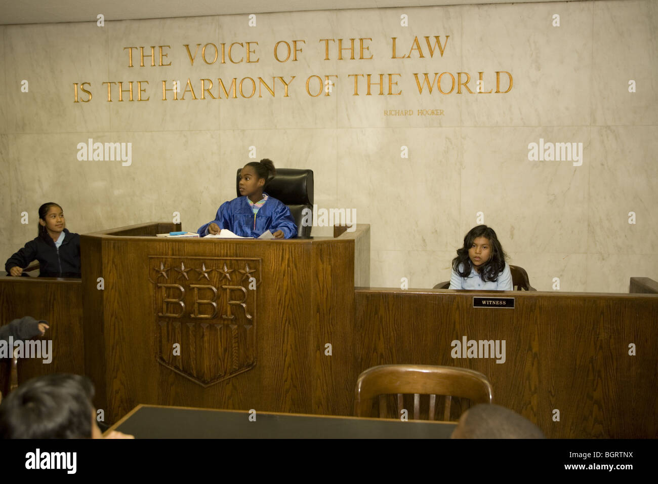 School children learn about the US judicial system by putting on mock trials in an education courtroom at NYC community center Stock Photo