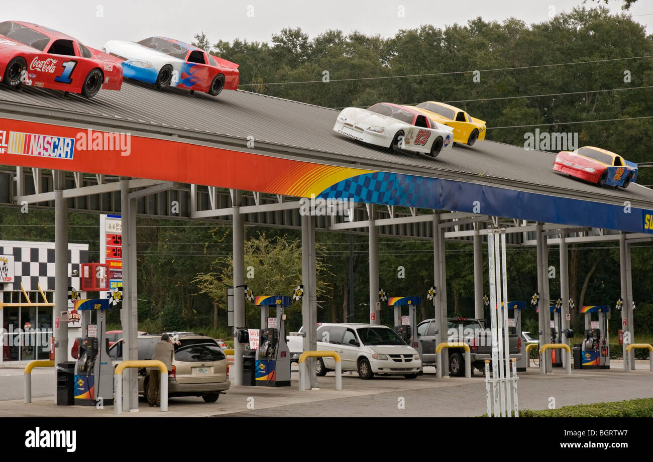 Ocala Florida gas station featuring NASCAR model cars atop overhead