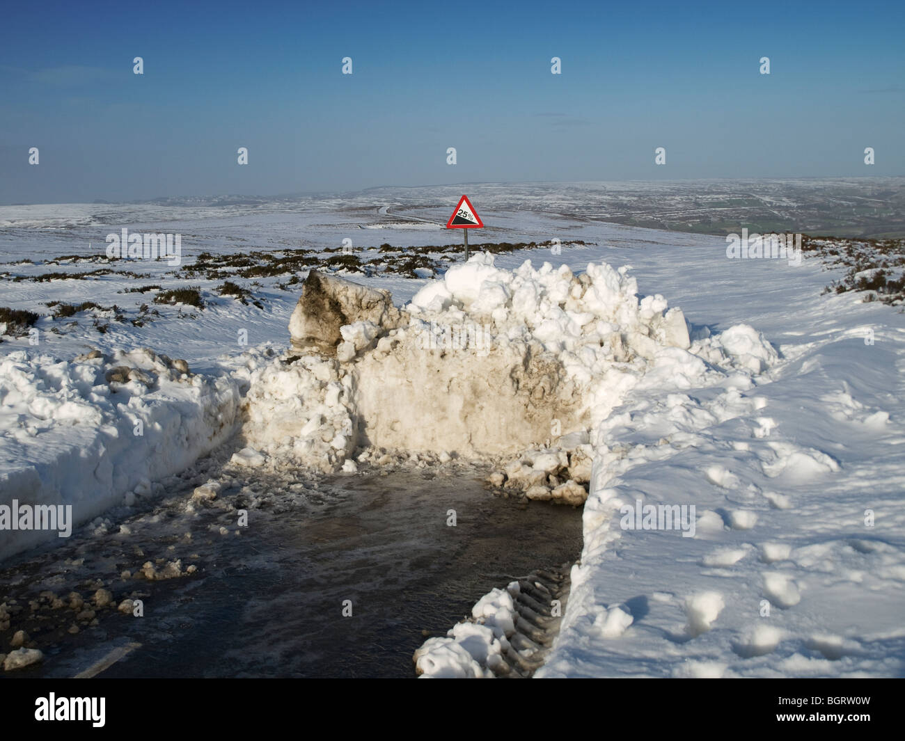 Road blocked by snow drift on North York Moors National Park Stock Photo