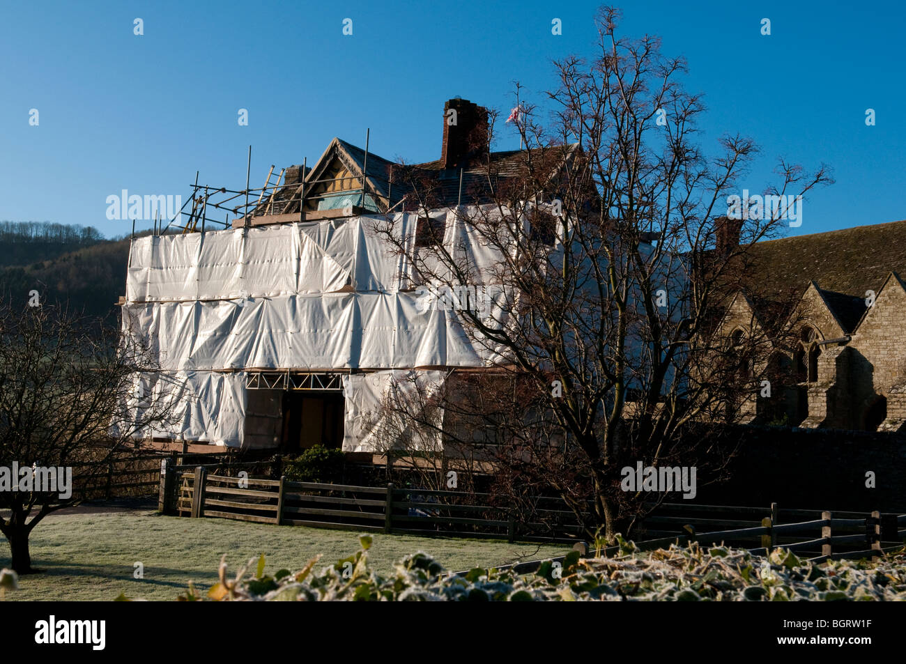 Stokesay Castle gatehouse, Shropshire, wrapped in plastic for restoration Stock Photo