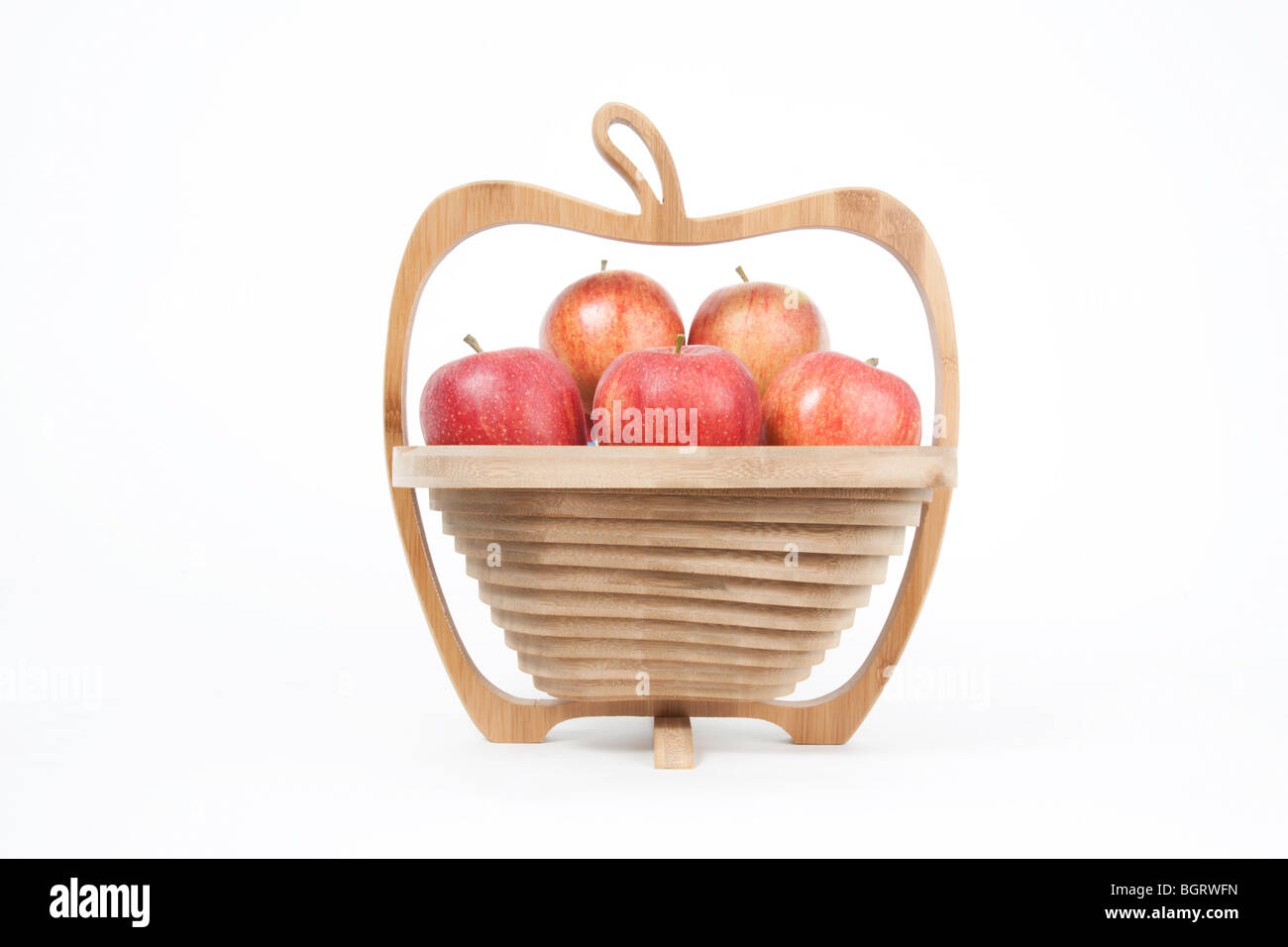 Apple shaped wooden fruit bowl of red apples Stock Photo - Alamy