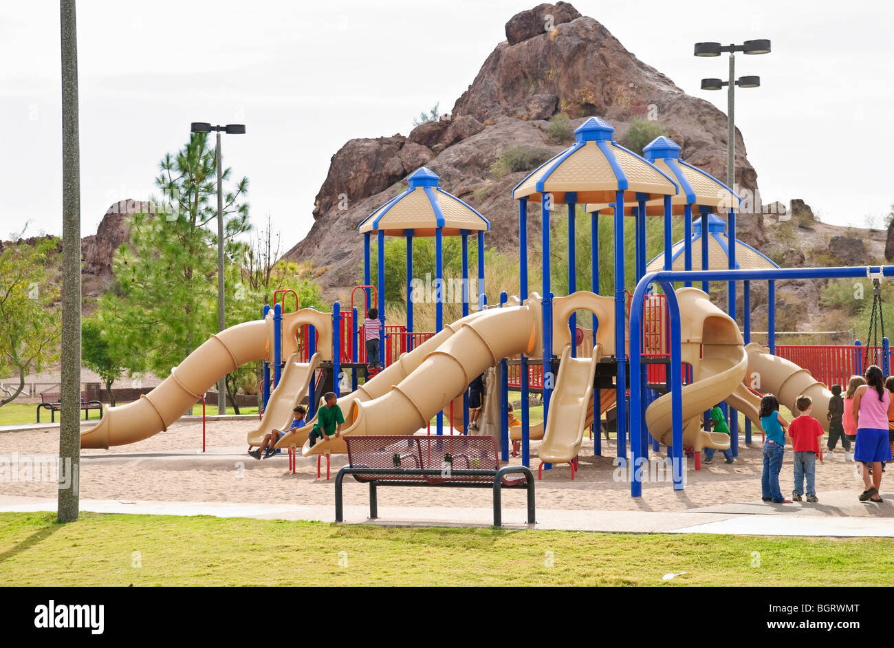Kids play on the playground in Papago Park in Tempe, Arizona Stock