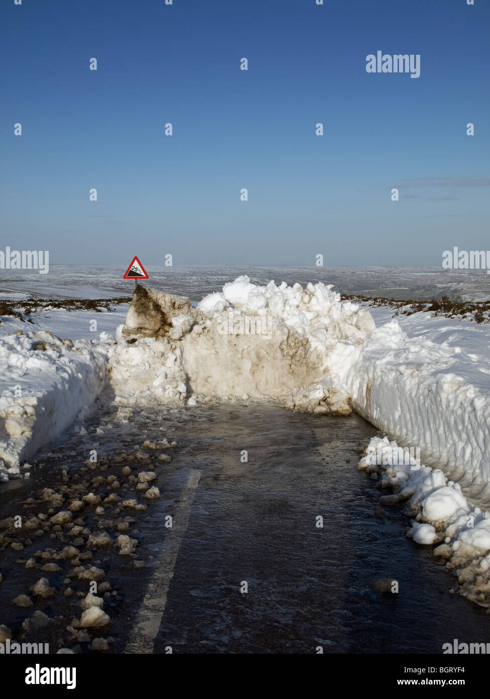 Road blocked by snow drift on North York Moors National Park Stock Photo