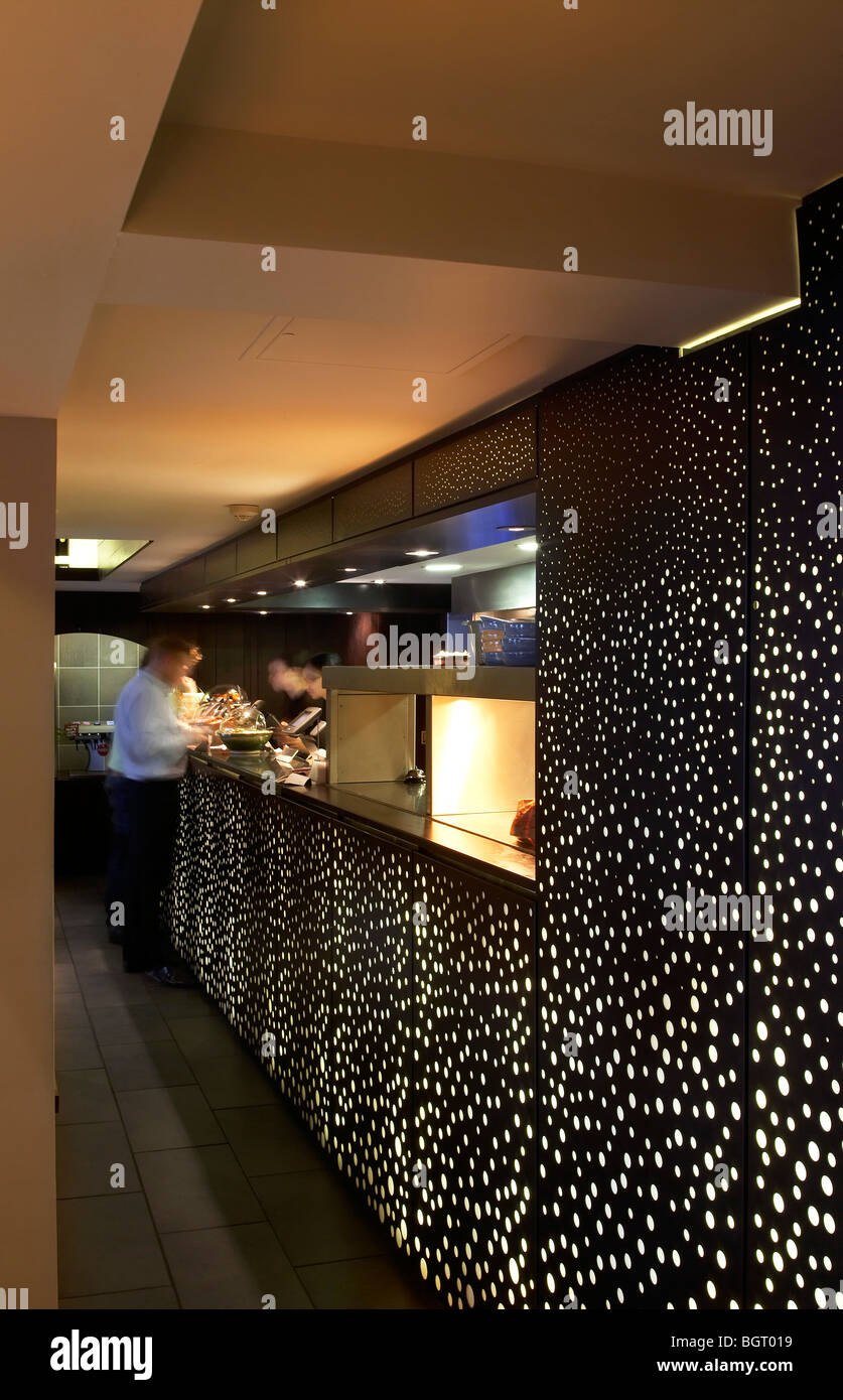 nando's restaurant beckenham, serving hatch with wall lighting Stock Photo