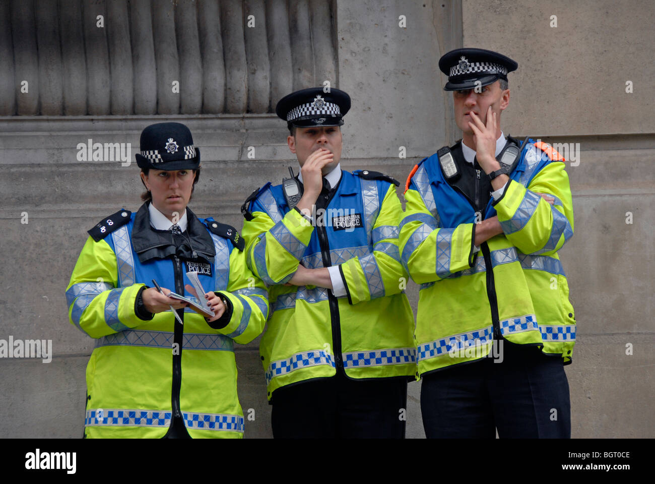 Three police officers looking puzzled Stock Photo