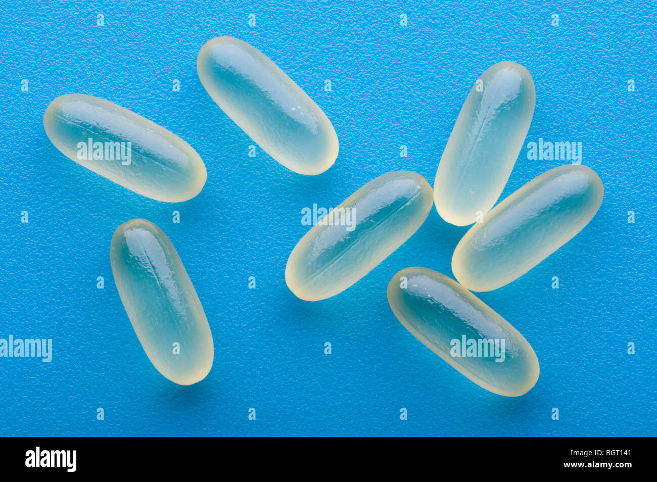 object on blue - Medical Tablets close up Stock Photo - Alamy