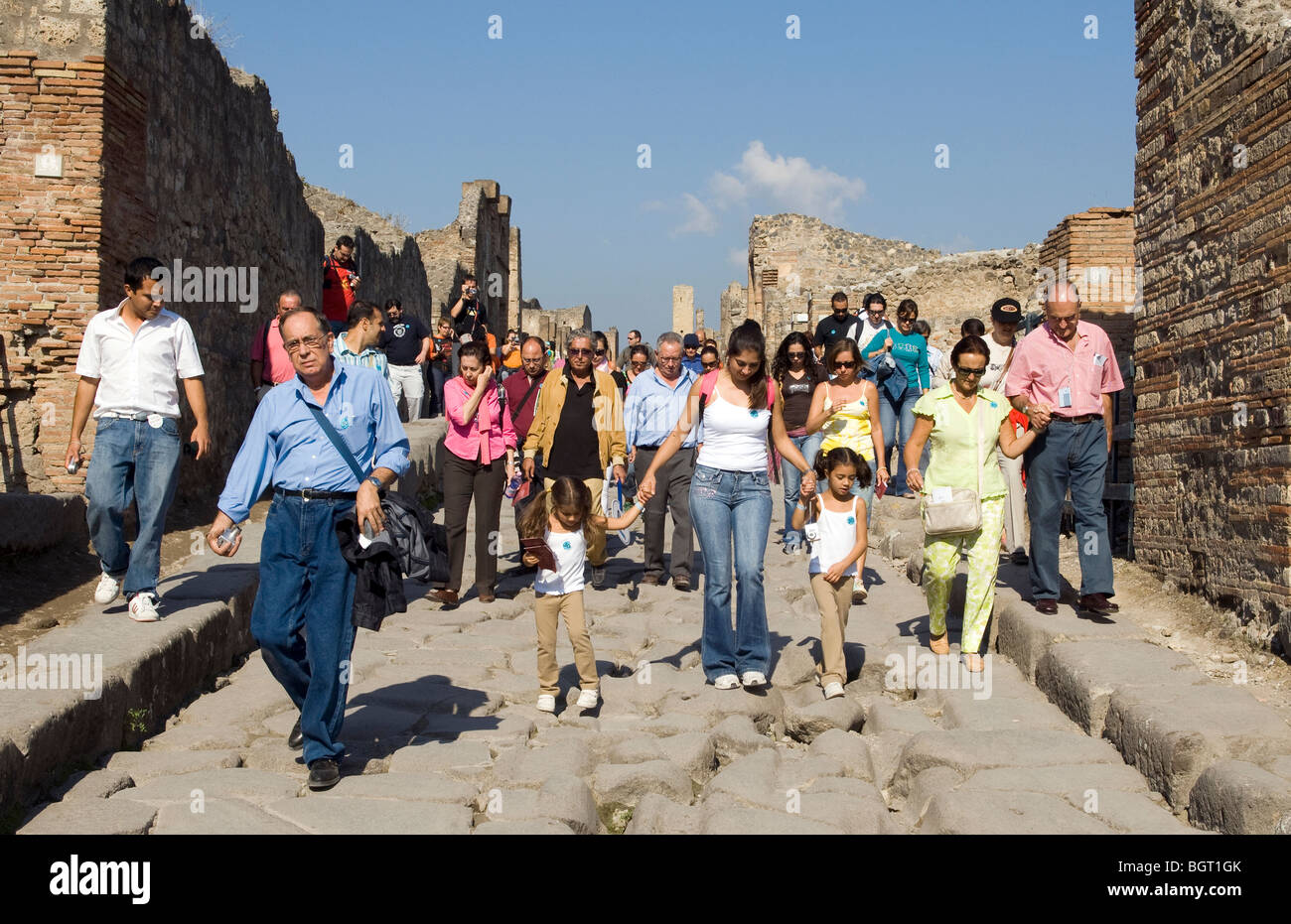 A large group of tourists walking the streets in Pompeii, nr Naples, Campania, Italy, Europe. Stock Photo