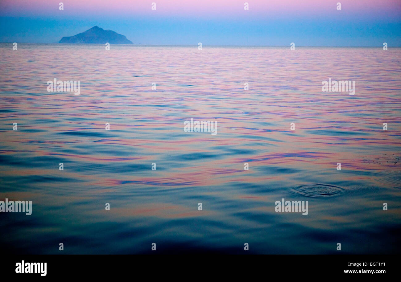 Late afternoon sky reflecting on calm ocean looking at Anacapa Island in Southern California Stock Photo