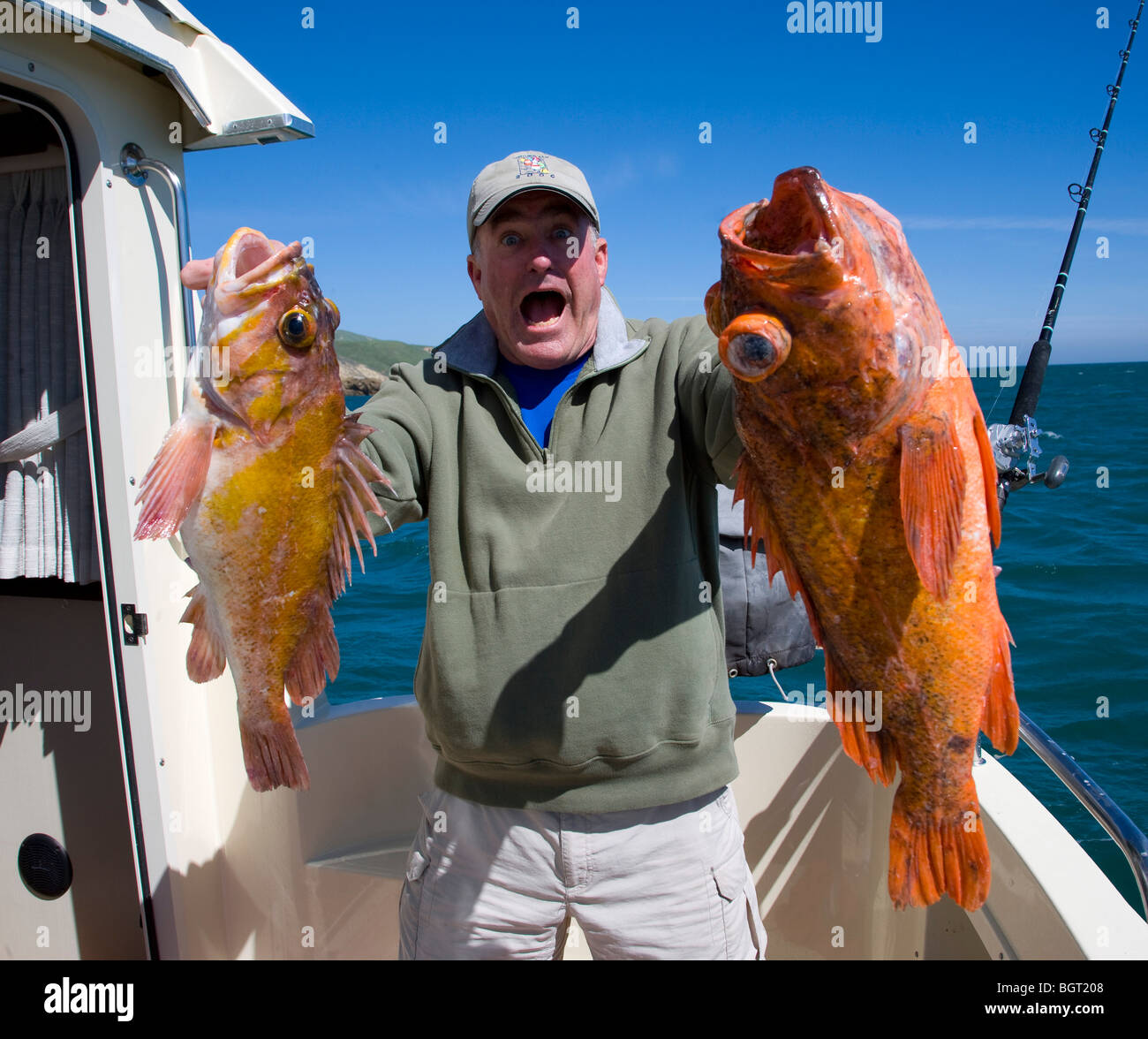 Ocean fisherman holding catch in California Stock Photo