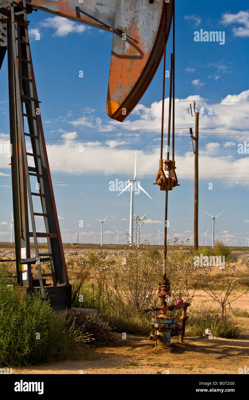 Old energy is still pulled from the earth, while  new energy from the wind is harnessed in west Texas. Stock Photo