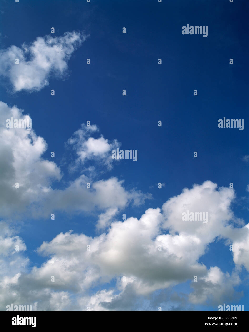 Clouds against a blue sky Stock Photo - Alamy